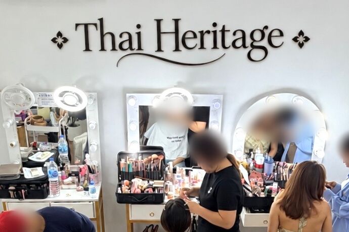 Make-up area of our studio: mirrors with lights under the Thai Heritage sign